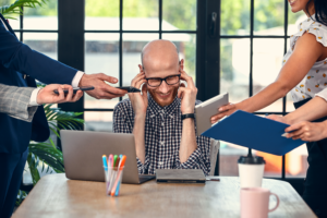 man overloaded with work