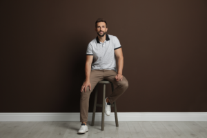 man sitting on stool